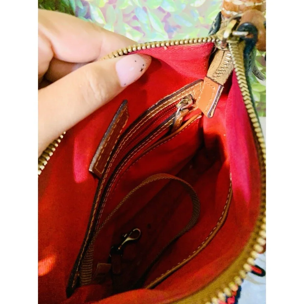 Dooney And Bourke Pebble Grain Small Tassel Crossbody Black And Brown